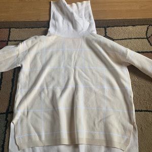 Cream and white turtleneck sweater